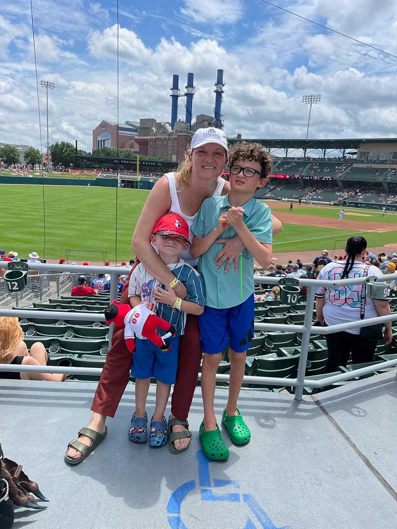 Kate Miller with her sons at a baseball game